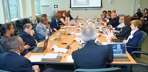 Meeting room with participants around the table