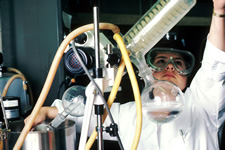 A scientist performing drug synthesis in a laboratory setting. Photo courtesy of the National Cancer Institute