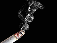Lit cigarette with smoke