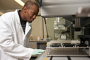 A researcher with sequencing equipment