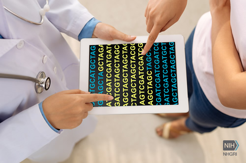A doctor and patient consult a DNA genomic sequence in a clinical setting.