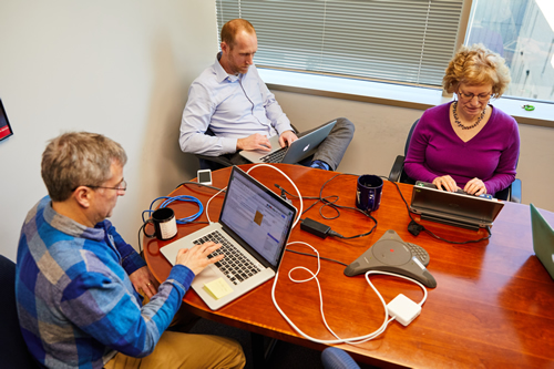 NHGRI staff work on computers