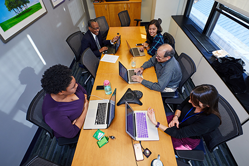 NHGRI staff work at a table