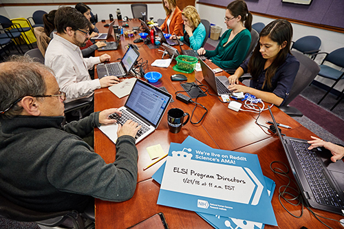 NHGRI staff work on computers