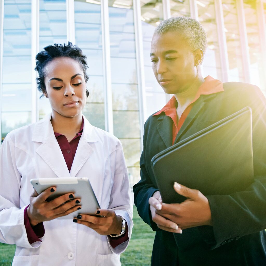 Two women looking at iPad