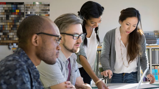 People looking at desk