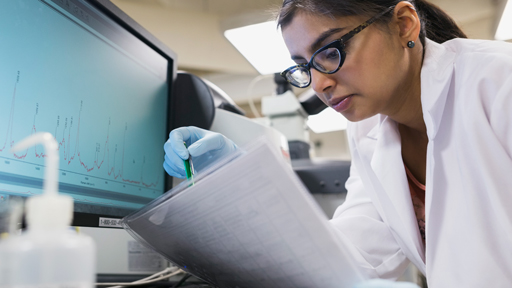 Scientist looking at papers