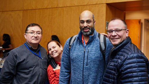 Group of NHGRI staff members smiling together