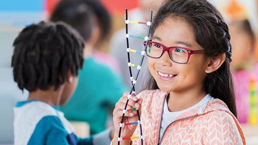 Child with a double-helix model 