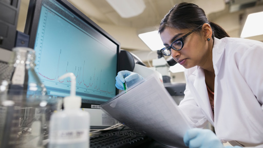 Researcher looking at results