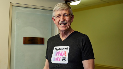 Dr. Collins wearing a fitted DNA Day shirt