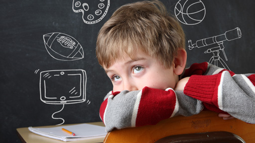 Child sitting in a chair and thinking with eyes cast upwards