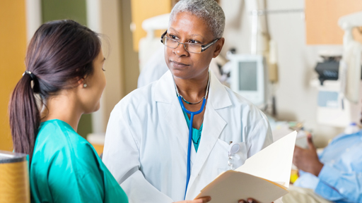 doctor and nurse discussing patient