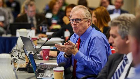 Man talking at conference