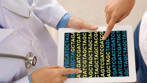 Doctor and patient looking at patient's genomic data